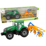 Zelený traktor s hrabľami na seno – trecí pohon