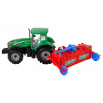 Zelený traktor s červeným pluhom