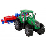 Zelený traktor s červeným pluhom