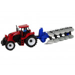 Červený traktor s pluhom Červený traktor s pluhom