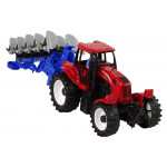 Červený traktor s pluhom